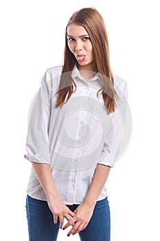 Girl shy showing tongue on white isolated background