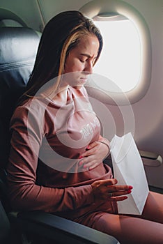 Girl is sick in the airplane