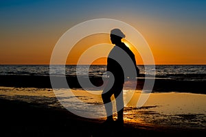 Girl silhouette at a seaside