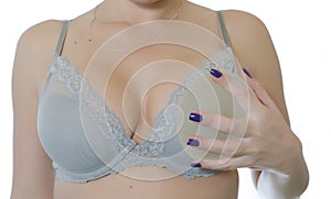 Girl with silicone breast implants and bra