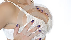 Girl with silicone breast implants and bra photo