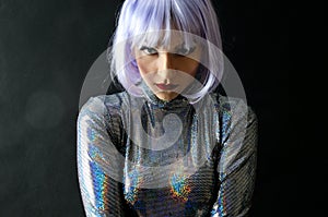 Girl in silver costume with purple wig