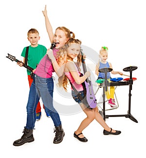 Girl singing and children playing as rock group