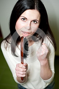 Girl singing on her hairbrush