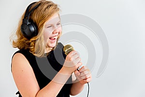 Girl singing with a microphone