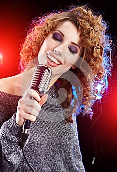 Girl singing in retro mic