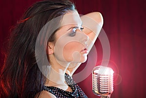 Girl singing in retro mic