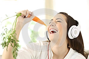Girl singing using a carrot as a microphone
