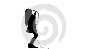 Girl sings in a retro rock song microphone. White background. Silhouette. Side view. Slow motion