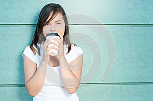 Girl sipping fresh coffee and being dreamy