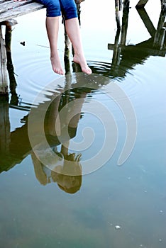 Girl sit on the small bridge