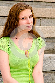 A girl sits on the dock