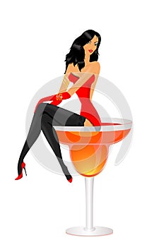 Girl sits in a glass with a cocktail