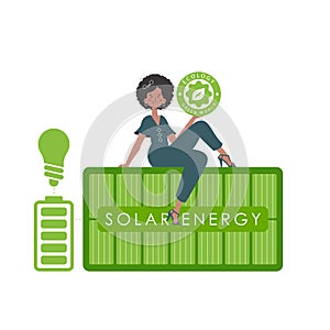 The girl sits on the solar panel and holds the ECO logo in her hands. The concept of ecology and green energy. Isolated