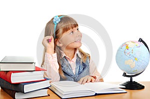 The girl sits at a table