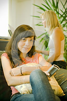 Girl sits watching television photo