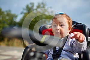 Girl sitting in a baby bike seat of a bicycle of her father safety emotions anxiety kids children parenting.