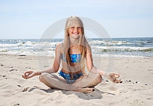 Girl sitting on beach