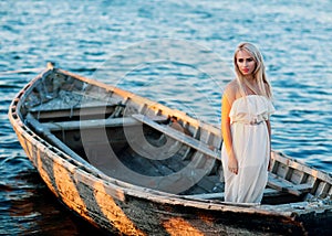 Girl is sitting in a boat