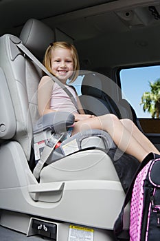 Girl Sitting In Booster Seat