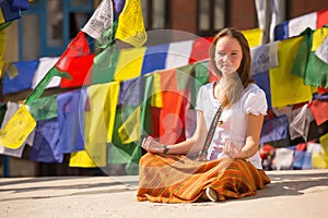 Girl sitting on Buddhist stupa