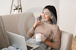 Girl Sitting with Cup of Morning Coffee And Laptop