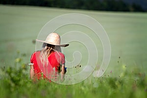 Girl sitting in a field