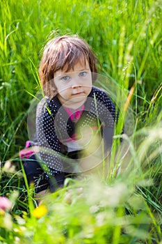 Girl sitting in grass