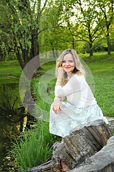 Girl sitting near the lake