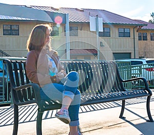 Girl Sitting Near Train Rails