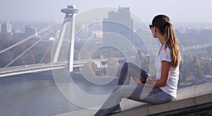 Girl sitting over Bratislava