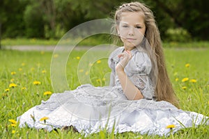 Girl sitting in the park and posing