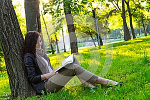 Girl sitting park read book photo