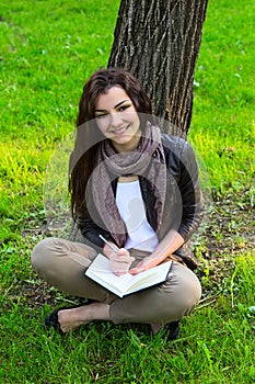 Girl sitting park read book