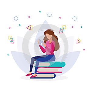 Girl sitting on pile of books with tablet in her hands.