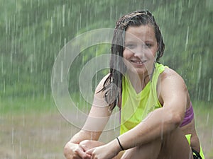 Girl sitting in the rain