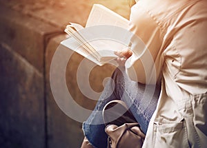 A girl sitting reading classical literature