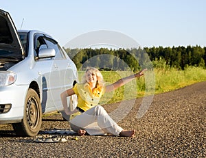 Girl sitting and signaling problems with the car