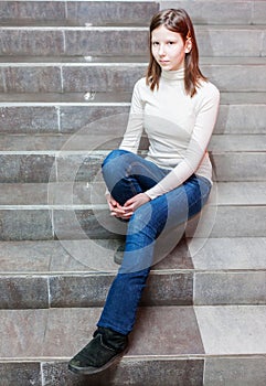 Girl sitting on stairs