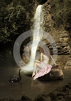 The girl sitting on the stone