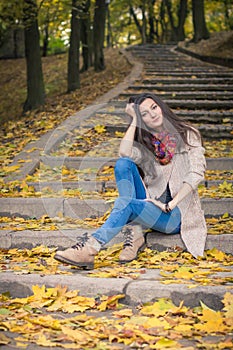 Girl sitting on stone steps