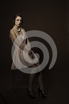 Girl sitting on a stool