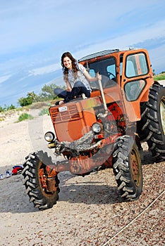 Girl sitting on the tractor