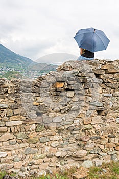 Girl sitting on a wall