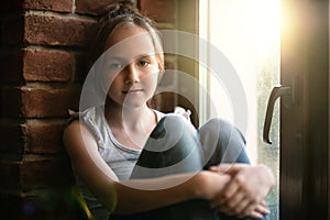 Girl sitting on the windowsill