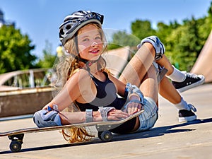 Girl with skateboard at the skate park. photo