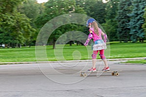 Girl skateboarding on natural background