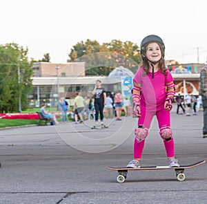 Girl skateboarding on natural background