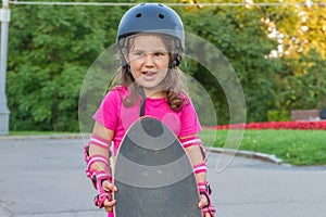 Girl skateboarding on natural background