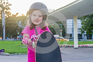 Girl skateboarding on natural background